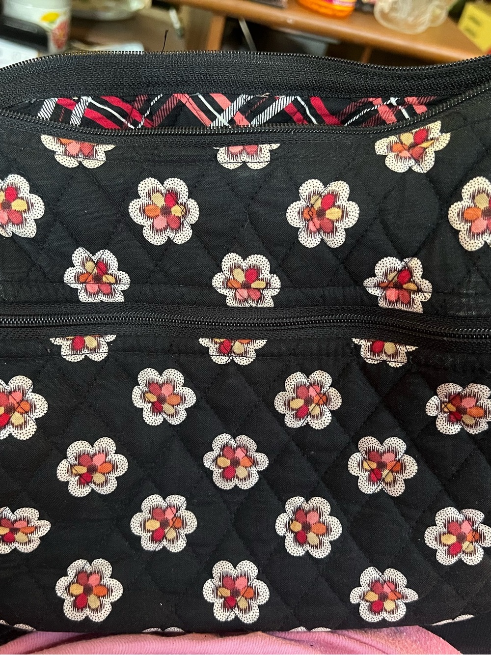 Vera Bradley handbag features a retired "Pirouette" black quilted cotton pattern